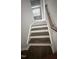 Carpeted staircase leading to the upper level of the home at 3112 Star Gazing Ln, Durham, NC 27703