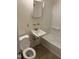 Functional bathroom featuring a toilet, sink, and tub at 317 Gary St, Durham, NC 27703