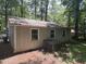 Exterior of home with siding and multiple windows. Needs repairs to roof and yard at 317 Gary St, Durham, NC 27703