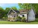 Charming home featuring white siding, a cozy front porch, and beautifully landscaped surroundings at 3188 Williams Ln, Graham, NC 27253
