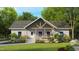 Inviting home featuring a charming front porch and manicured lawn, offering a warm welcome at 3188 Williams Ln, Graham, NC 27253