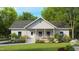 Charming single-story home with a welcoming front porch and lush landscaping at 3188 Williams Ln, Graham, NC 27253