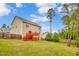 A spacious backyard with a red wood deck, fenced perimeter, and a well-maintained lawn, perfect for outdoor activities at 32 Lattimore Rd, Cameron, NC 28326