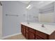Bathroom featuring double sinks, vanity with storage, and large mirror at 32 Lattimore Rd, Cameron, NC 28326