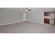 Large bonus room features a convenient wet bar, ceiling fan, and plush carpeting at 32 Lattimore Rd, Cameron, NC 28326