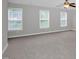 Spacious bonus room with three windows and a ceiling fan provides natural light and comfort at 32 Lattimore Rd, Cameron, NC 28326