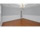 Charming dining room with hardwood floors, chandelier, and decorative wainscoting offers a welcoming atmosphere at 32 Lattimore Rd, Cameron, NC 28326