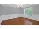 Dining room with chandelier, hardwood floors, and wainscoting at 32 Lattimore Rd, Cameron, NC 28326