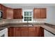 Close up of kitchen featuring granite countertops, stainless steel appliances, and plenty of cabinet space at 32 Lattimore Rd, Cameron, NC 28326