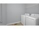 Laundry room featuring washer, dryer, and wire shelf at 32 Lattimore Rd, Cameron, NC 28326