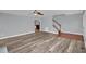 Open living space showcasing neutral walls, modern flooring, and access to the staircase at 32 Lattimore Rd, Cameron, NC 28326