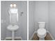 Powder room with pedestal sink and toilet at 32 Lattimore Rd, Cameron, NC 28326