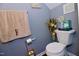 Bathroom with a standard toilet, decorative towels, and wall art at 3848 Griffis Glen Dr, Raleigh, NC 27610