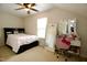 Bedroom features modern decor, light walls, and ceiling fan at 3848 Griffis Glen Dr, Raleigh, NC 27610