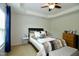 Bedroom featuring tray ceilings, and a large bed with decorative pillows at 3848 Griffis Glen Dr, Raleigh, NC 27610