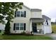 Charming two-story home featuring a well-maintained lawn and inviting front porch at 3848 Griffis Glen Dr, Raleigh, NC 27610