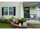 Close up of the decorations and sitting area on the home's front porch at 3848 Griffis Glen Dr, Raleigh, NC 27610
