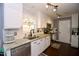 Bright kitchen with white cabinets, granite countertops, stainless steel appliances, and a stylish backsplash at 3848 Griffis Glen Dr, Raleigh, NC 27610