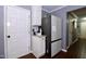 Functional kitchen area featuring a refrigerator and access to an additional room at 3848 Griffis Glen Dr, Raleigh, NC 27610