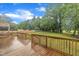Large wooden deck with railing overlooking a well-maintained yard at 397 Meadow Rd, Kenly, NC 27542
