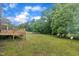 Expansive backyard with lush green grass and mature trees at 397 Meadow Rd, Kenly, NC 27542