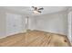 Bedroom with hardwood flooring, ceiling fan, double door closet, and natural light at 397 Meadow Rd, Kenly, NC 27542