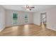Bright bedroom with hardwood floors, double windows overlooking backyard, and neutral paint at 397 Meadow Rd, Kenly, NC 27542