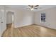 Bedroom with natural light, ceiling fan, laminate flooring, and doorway at 397 Meadow Rd, Kenly, NC 27542