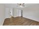 Bedroom featuring wood floors, ceiling fan, and multiple closets at 397 Meadow Rd, Kenly, NC 27542