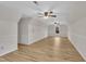 Spacious bonus room with vaulted ceilings, laminate floors, and dual ceiling fans at 397 Meadow Rd, Kenly, NC 27542