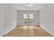 Bright dining room with wood floors, white trim and double doors to outdoor space at 397 Meadow Rd, Kenly, NC 27542