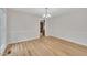 Dining room featuring hardwood floors, a chandelier, and large windows with greenery views at 397 Meadow Rd, Kenly, NC 27542