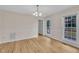 Dining room featuring hardwood floors, a chandelier, and a back patio view at 397 Meadow Rd, Kenly, NC 27542