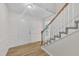 Bright foyer with hardwood flooring, staircase, and ample natural light at 397 Meadow Rd, Kenly, NC 27542