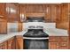 Traditional kitchen features wood cabinets, modern appliances, and light countertops at 397 Meadow Rd, Kenly, NC 27542