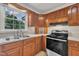 Kitchen featuring wooden cabinets, stainless steel oven, and lots of counter space at 397 Meadow Rd, Kenly, NC 27542