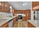 Kitchen featuring wooden cabinets, stainless steel appliances, and ample counter space at 397 Meadow Rd, Kenly, NC 27542