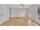 Spacious living room with hardwood floors, abundant natural light, and modern ceiling fan at 397 Meadow Rd, Kenly, NC 27542