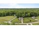 Aerial view showcasing a home with a vast wooded backdrop and spacious surroundings at 422 River Ridge Ln, Timberlake, NC 27583