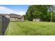 Spacious backyard with lush green grass, a storage shed, and an open patio perfect for outdoor activities at 422 River Ridge Ln, Timberlake, NC 27583