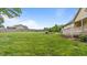 Expansive backyard with lush green grass, wooden fence, and potential for outdoor activities at 422 River Ridge Ln, Timberlake, NC 27583