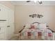 Inviting bedroom featuring a ceiling fan and decoratively quilted daybed at 422 River Ridge Ln, Timberlake, NC 27583