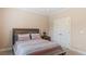 Cozy bedroom with neutral tones featuring a comfortable bed and ample closet space at 422 River Ridge Ln, Timberlake, NC 27583