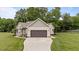 Well-maintained single-Gathering home with a two-car garage, landscaped front yard, and lovely front porch at 422 River Ridge Ln, Timberlake, NC 27583