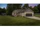 Charming single-Gathering home with a well-manicured lawn, two-car garage, and inviting front porch at 422 River Ridge Ln, Timberlake, NC 27583