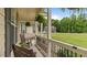 Relaxing front porch with rocking chairs, hanging plants, and a view of the manicured front yard at 422 River Ridge Ln, Timberlake, NC 27583