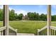 Welcoming view from the front porch with a spacious front yard and neighborhood views at 422 River Ridge Ln, Timberlake, NC 27583
