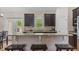 Eat-in kitchen island featuring granite countertops, dark cabinets and stylish decor at 422 River Ridge Ln, Timberlake, NC 27583