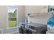 Practical laundry room equipped with modern front load washer and dryer, and great natural light at 422 River Ridge Ln, Timberlake, NC 27583