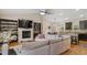 Open-concept living room showcasing a fireplace, built-in cabinets, and seamless flow into the dining area at 422 River Ridge Ln, Timberlake, NC 27583